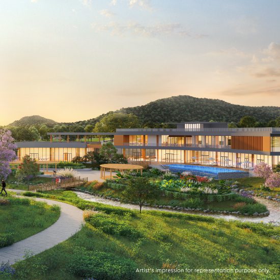 Modern clubhouse surrounded by greenery and landscape views at Godrej Verdania Estate.